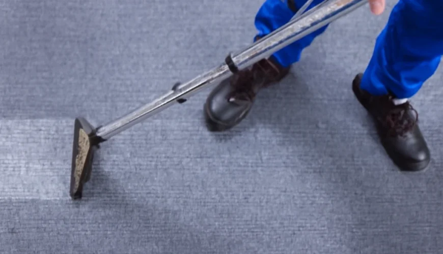 Professional carpet cleaner using advanced equipment to provide the best commercial carpet cleaning services, ensuring a spotless, well-maintained carpet.